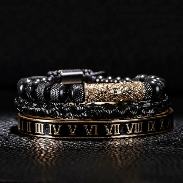 Close-up of gold Imperial Roman bracelet stack with black enamel and gold detail