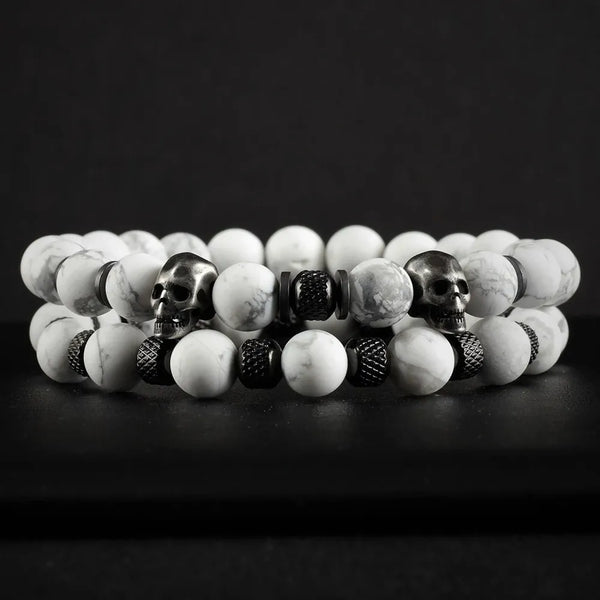 White Stone Skull Bracelet Set displayed on dark surface featuring two beaded bracelets with marble-pattern beads and skull accents