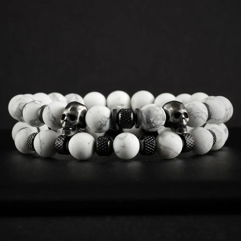 White Stone Skull Bracelet Set displayed on dark surface featuring two beaded bracelets with marble-pattern beads and skull accents