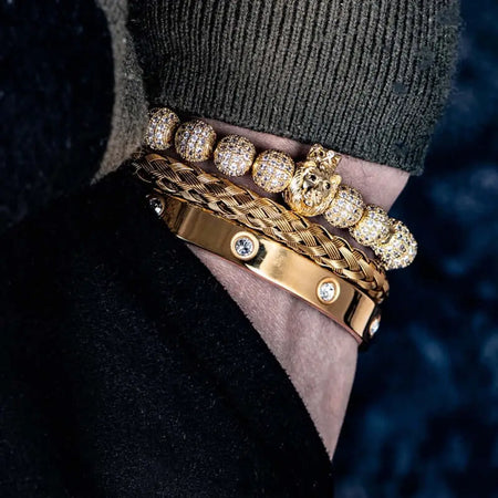 Gold lion head bracelet set for men featuring crystal beads, braided chain, and luxury cuff with CZ stones.