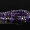Close-up of Amethyst Stone Skull Bracelet Set showing natural purple beads and detailed stainless-steel skull charm