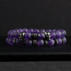 Two-piece Amethyst Stone Skull Bracelet Set featuring purple beaded bracelets with metal skull elements