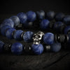 Close-up of blue stone beaded bracelet with detailed stainless-steel skull charm