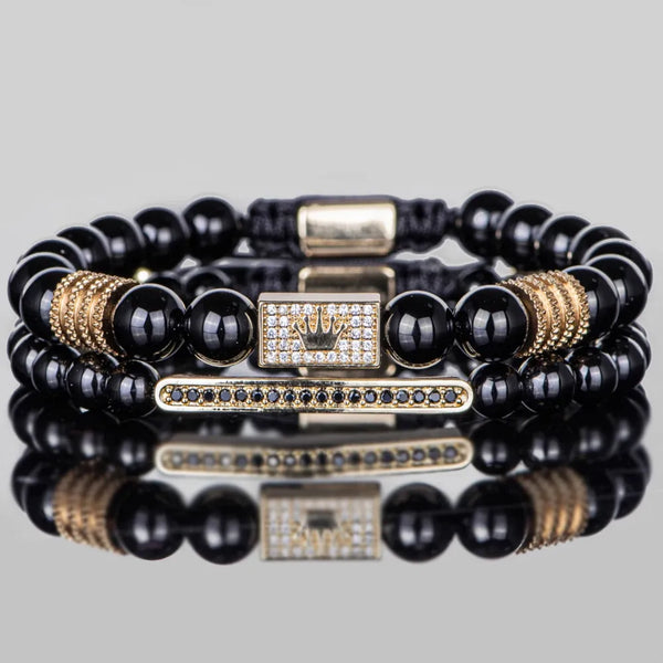 Black and gold crown bracelet front view with zircon stones and gold details